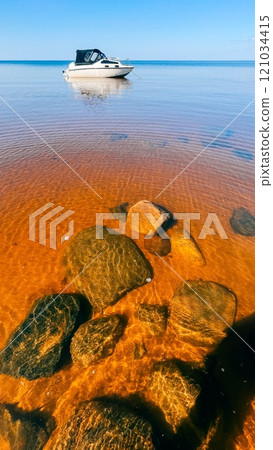 White yacht and stones under water, very clear water of the White Sea White yacht and stones under water, very clear water of the White Sea 121034415