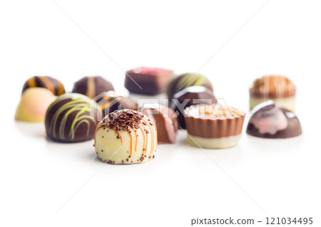 Mix of chocolate pralines isolated on white background. Mix of chocolate pralines isolated on white background. 121034495
