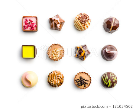 Mix of chocolate pralines isolated on white background. Mix of chocolate pralines isolated on white background. 121034502