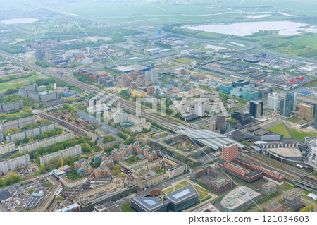 City Amsterdam skyline seen from an aerial view in cloudy weather is composed panorama of over rooftops 121034603
