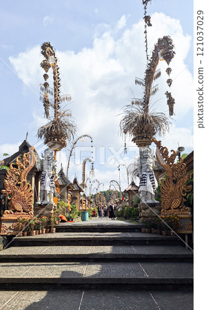 Editorial image of tourists exploring Panglipuran Village in Bali on November 9, 2024, beautifully adorned with penjor decorations for Galungan and Kuningan celebrations. Editorial image of tourists exploring Panglipuran Village in Bali on November 9, 2024, beautifully adorned with penjor decorations for Galungan and Kuningan celebrations. 121037029