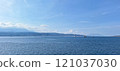 A serene view of the Bali Sea with calm blue waters and blue sky 121037030