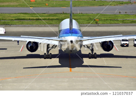 A passenger plane parked at Haneda Airport's Terminal 2 parking lot and the surrounding area 121037037