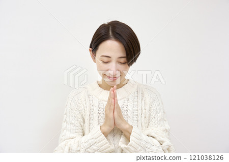 Praying woman on white background Praying woman on white background 121038126