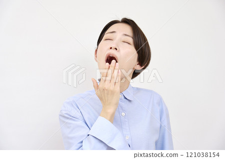 Yawning woman on white background Yawning woman on white background 121038154