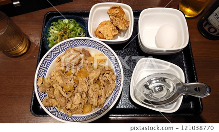 Beef bowl with green onions and egg and fried chicken Beef bowl with green onions and egg and fried chicken 121038770