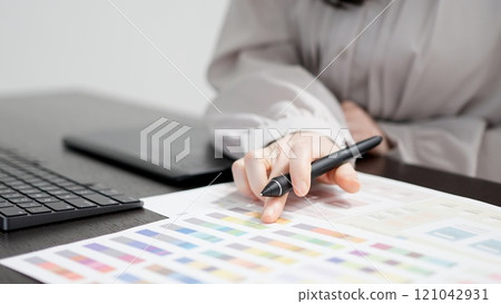 A creative woman working on a computer A creative woman working on a computer 121042931