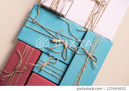 Colorful Gift Boxes Tied With Rustic Twine 121043632