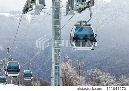 Gondola lifts on ski resort in the winter mountains Gondola lifts on ski resort in the winter mountains 121043670