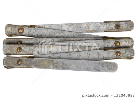 Antique carpenter's brass ruler isolated on white. 121043982