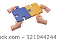 Two hands hold puzzle pieces as a solution to a problem. Solution, unity, partnership concept, teamwork, work and joint project completion in cooperation. 121044244