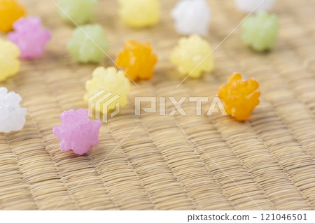 Colorful sugar candies scattered on a tatami mat 121046501