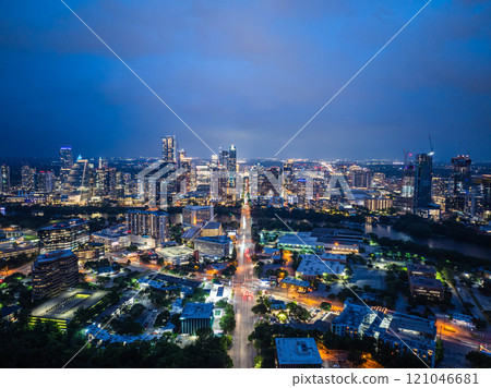 Austin, Texas skyline shining brightly at twilight with city lights creating a captivating display across the cityscape, mirroring vibrant spirit of an american metropolis Austin, Texas skyline shining brightly at twilight with city lights creating a captivating display across the cityscape, mirroring vibrant spirit of an american metropolis 121046681