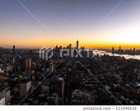 One World Trade Center, Lower Manhattan and NoMad district gleam at sunset with a crescent moon and Upper New York Bay in the background One World Trade Center, Lower Manhattan and NoMad district gleam at sunset with a crescent moon and Upper New York Bay in the background 121046816