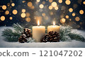Burning christmas candles with pine cones and branches on snowy background 121047202