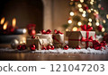 Christmas gifts resting under the tree by a lit fireplace 121047203