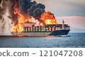 Dramatic Cargo Ship Fire at Sea with Intense Flames and Smoke 121047208