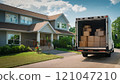 Moving Truck With Boxes Outside a Suburban House 121047210