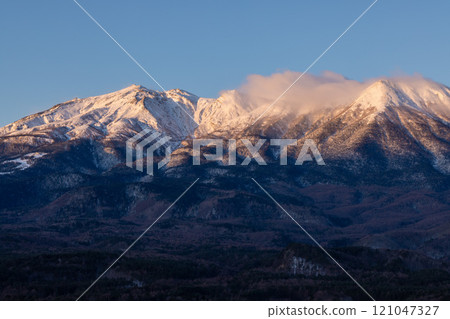 Mount Ontake in winter illuminated by the morning sun Mount Ontake in winter illuminated by the morning sun 121047327