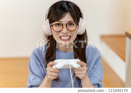 Middle-aged woman enjoying a game 121048170