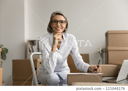 Happy grey haired entrepreneur woman workplace business portrait 121048176