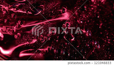 Red condense. Glossy wetness. Mystery shiny area covered with defocused flowing water drops foil effect. Smooth condensation background texture. Red condense. Glossy wetness. Mystery shiny area covered with defocused flowing water drops foil effect. Smooth condensation background texture. 121048833