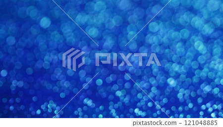 Blurred shimmer. Blue flare. Soft shimmering decorative glow of light glitter colors. Happy daylight pastel hue festive background. 121048885