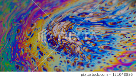 Dye mix. Neon fluid. Defocused multicolor purple green liquid oil paint curve acrylic slick on dark black blurred light abstract art background. 121048886