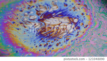 Acid liquid. Bubble paint. Defocused multicolor purple green oil rainbow curve acrylic slick on dark black blurred light abstract art background. Acid liquid. Bubble paint. Defocused multicolor purple green oil rainbow curve acrylic slick on dark black blurred light abstract art background. 121048890