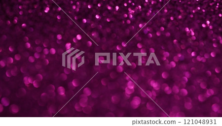 Defocused ray. Hypnotic sparkling. Neon pink small light spots of different shade shining sand on pink background. Changing glitter fairy luminosity. 121048931