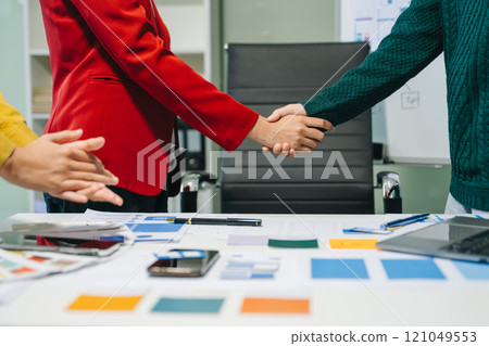 Close up view of UI developer team brainstorming on their project with laptop, smartphone and digital tablet. 121049553