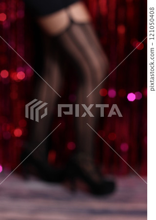 Blurred Burlesque Dancer With Pink Bokeh Background 121050408