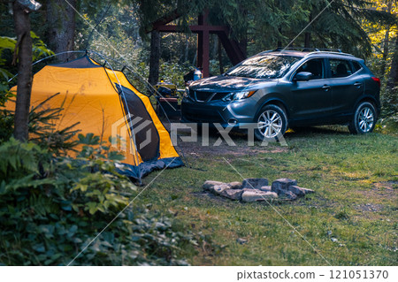 Serene Camping Scene in a Lush Forest Serene Camping Scene in a Lush Forest 121051370