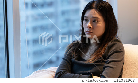 woman with poker face and feel cool when evening 121051908