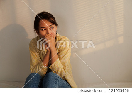 Depressed young asian woman with mental health problem in mind need crucial treatment from overthinking fatigue girl, disruptive thought, dissocial, anxiety and mental health disorders. 121053406