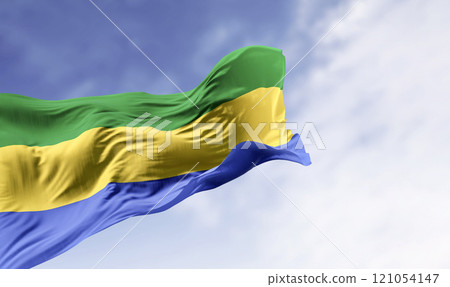 National flag of Gabon waving in the wind on a clear day 121054147