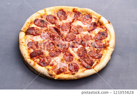 Pizza pepperoni fast food . Top view on rustic background 121055628