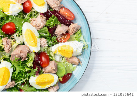 Canned Tuna salad with eggs and tomatoes photography . Top view 121055641