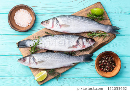 Raw sea bass fish photography . Top view Raw sea bass fish photography . Top view 121055662