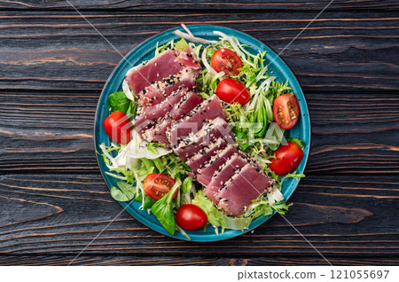 Salad with raw tuna , sesame and cherry tomatoes photography . Top view Salad with raw tuna , sesame and cherry tomatoes photography . Top view 121055697