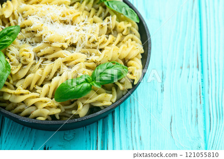 Pasta with basil sauce pesto . Italian food photography . Top view 121055810