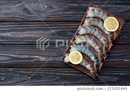 Raw big tiger ( king ) shrimps Cleaned, Peeled & Deveined photography . Top view 121055849