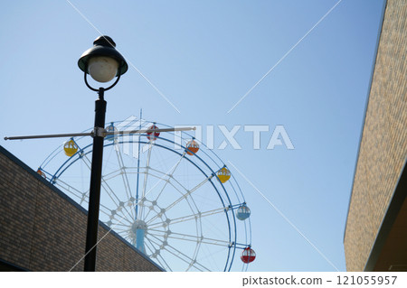 A street with a Ferris wheel 121055957