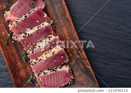 Sliced tuna steak with sesame photography . Top view 121056133