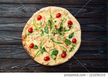 Italian pizza with avocado salmon  tomatoes and mozzarella photography. top view 121056153