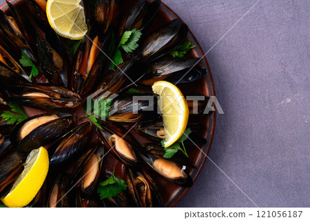 Mussels with parsley on a plate photography 121056187