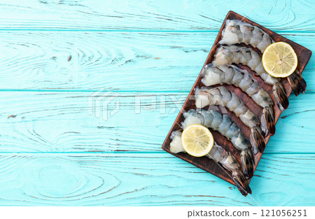Raw big tiger ( king ) shrimps Cleaned, Peeled & Deveined photography . Top view 121056251