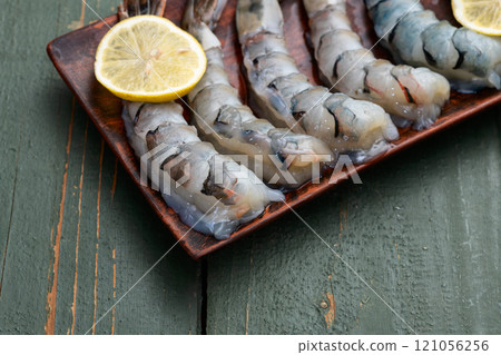 Raw big tiger ( king ) shrimps Cleaned, Peeled & Deveined photography . Top view Raw big tiger ( king ) shrimps Cleaned, Peeled & Deveined photography . Top view 121056256