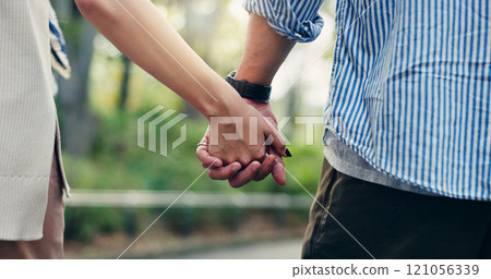 Couple, back and outdoor with holding hands, walk and support for romantic getaway or connection. Woman, man and bonding as together for solidarity, love or weekend as tourist for travel in Indonesia Couple, back and outdoor with holding hands, walk and support for romantic getaway or connection. Woman, man and bonding as together for solidarity, love or weekend as tourist for travel in Indonesia 121056339