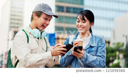 Excited, phone or Japanese couple in city on location, street or holiday adventure journey in Tokyo. Wow, coffee or happy people with smile, surprise or mobile app for travel trip, navigation or news Excited, phone or Japanese couple in city on location, street or holiday adventure journey in Tokyo. Wow, coffee or happy people with smile, surprise or mobile app for travel trip, navigation or news 121056368